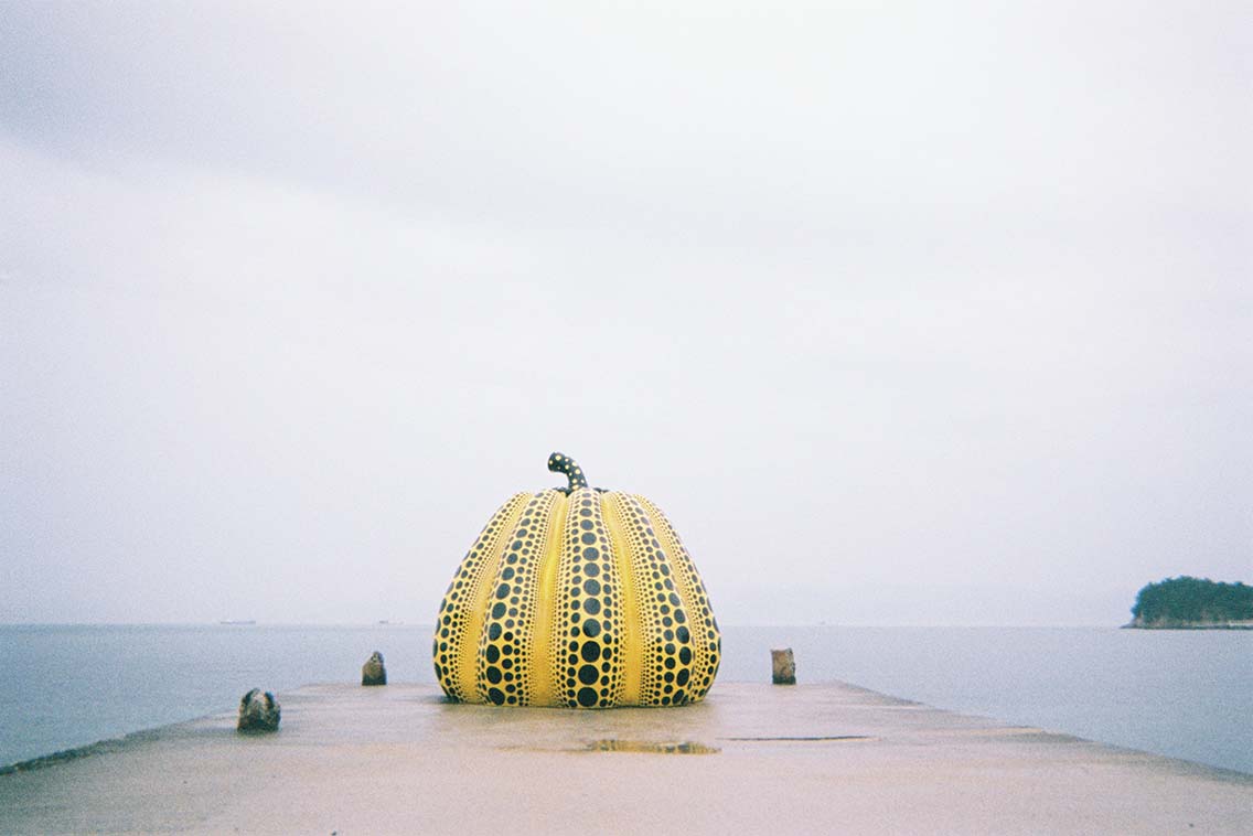 Picture of Yayoi Kusama's Yellow Pumpkin sculpture on Naoshima Island