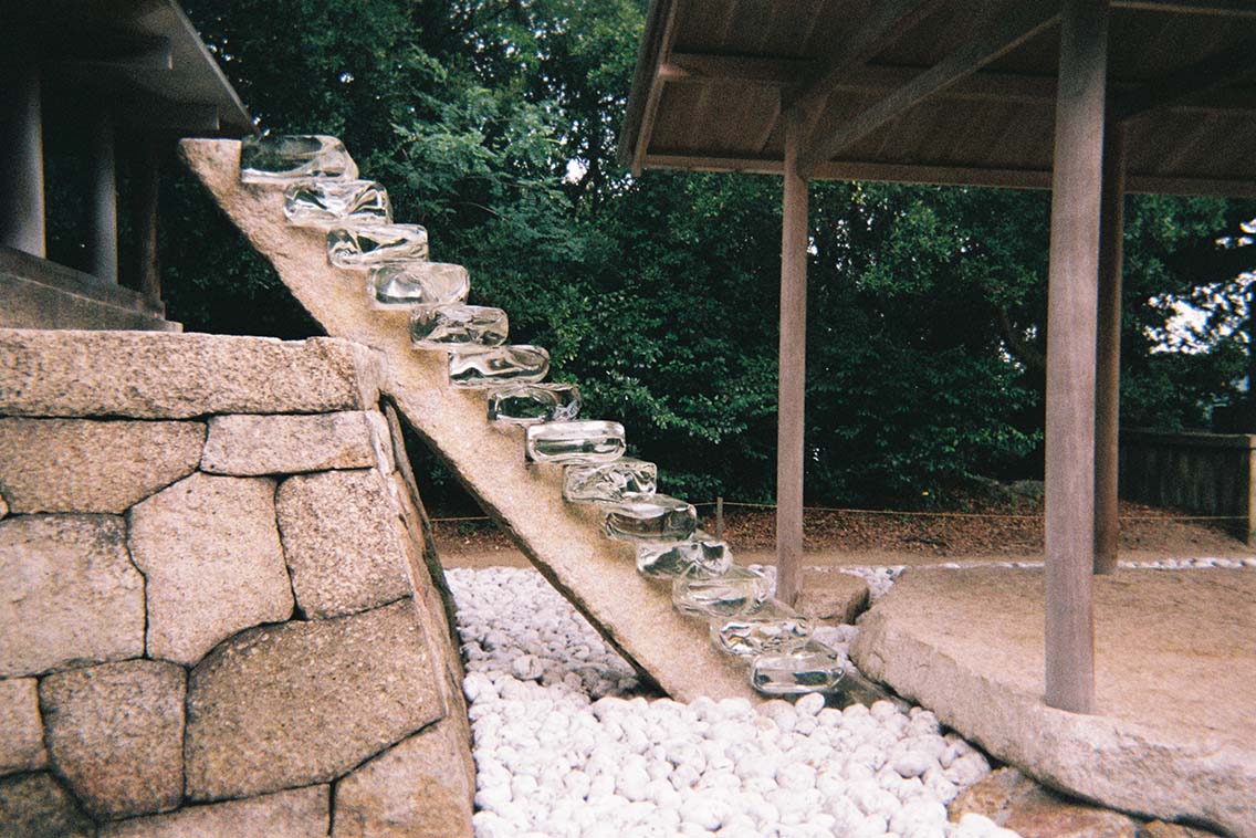 Picture of a flight of glass stairs, part of Hiroshi Sugimoto restoration of the Go'o Shrine on Naoshima Island