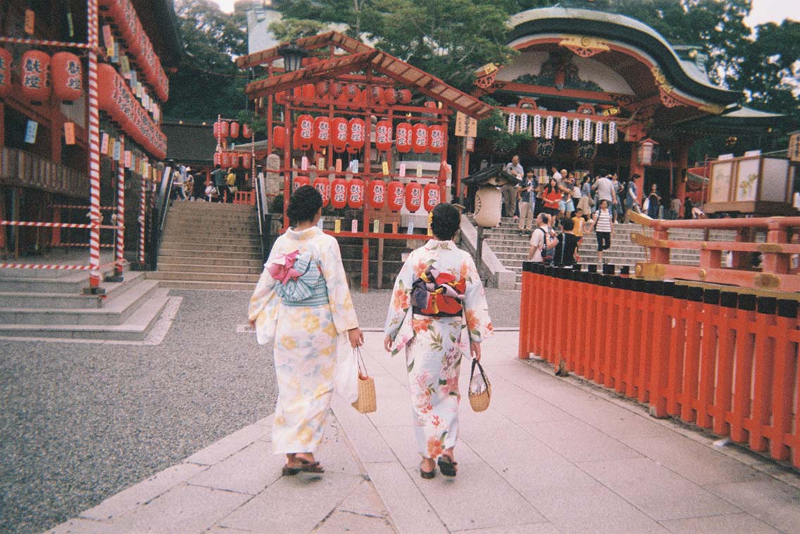 Picture of two geishas walking at Fushimi Inari-taisha during Motomiya-sai festival